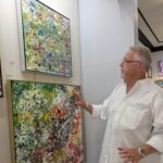 Gallery 1 - Artist Gene Howard with his artwork at Blackhawk Gallery. Photo by ARTSCCC.