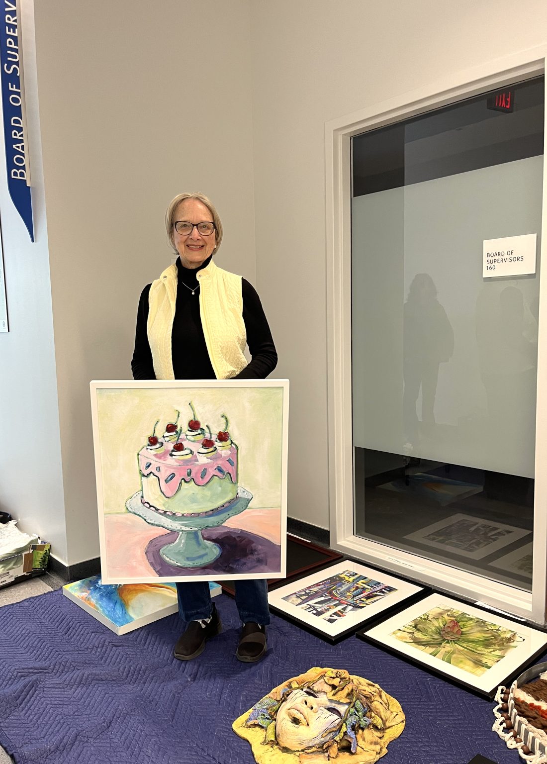 Gallery 1 - Artist Pamela McCauley at the installation of an Art Passages Exhibit at the County Administration Building in Martinez, CA. Photo by ARTSCCC.
