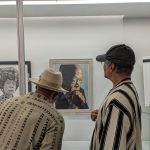 Gallery 3 - Artists Lawrence Buford and Malcom Ryder observing artwork by Lawrence Buford at an Art Passages Exhibit at the County Administration Building in Martinez, CA. Photo by ARTSCCC.