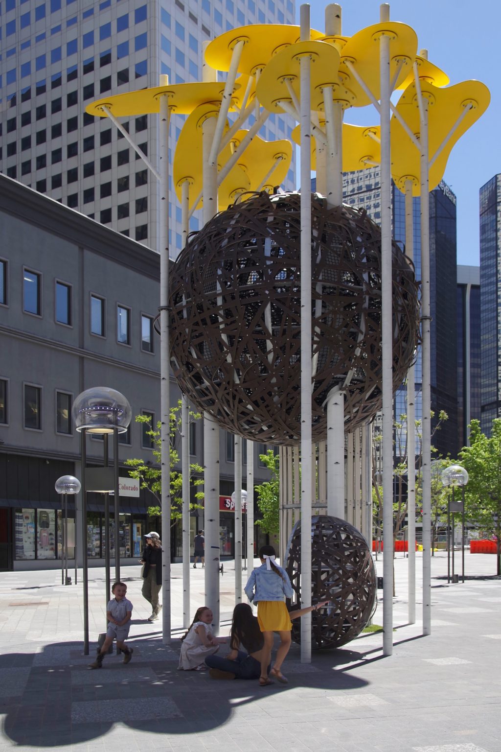 Gallery 1 - 30' high playground sculpture resembling stand of Aspen trunks with large nest and leaf canopy.