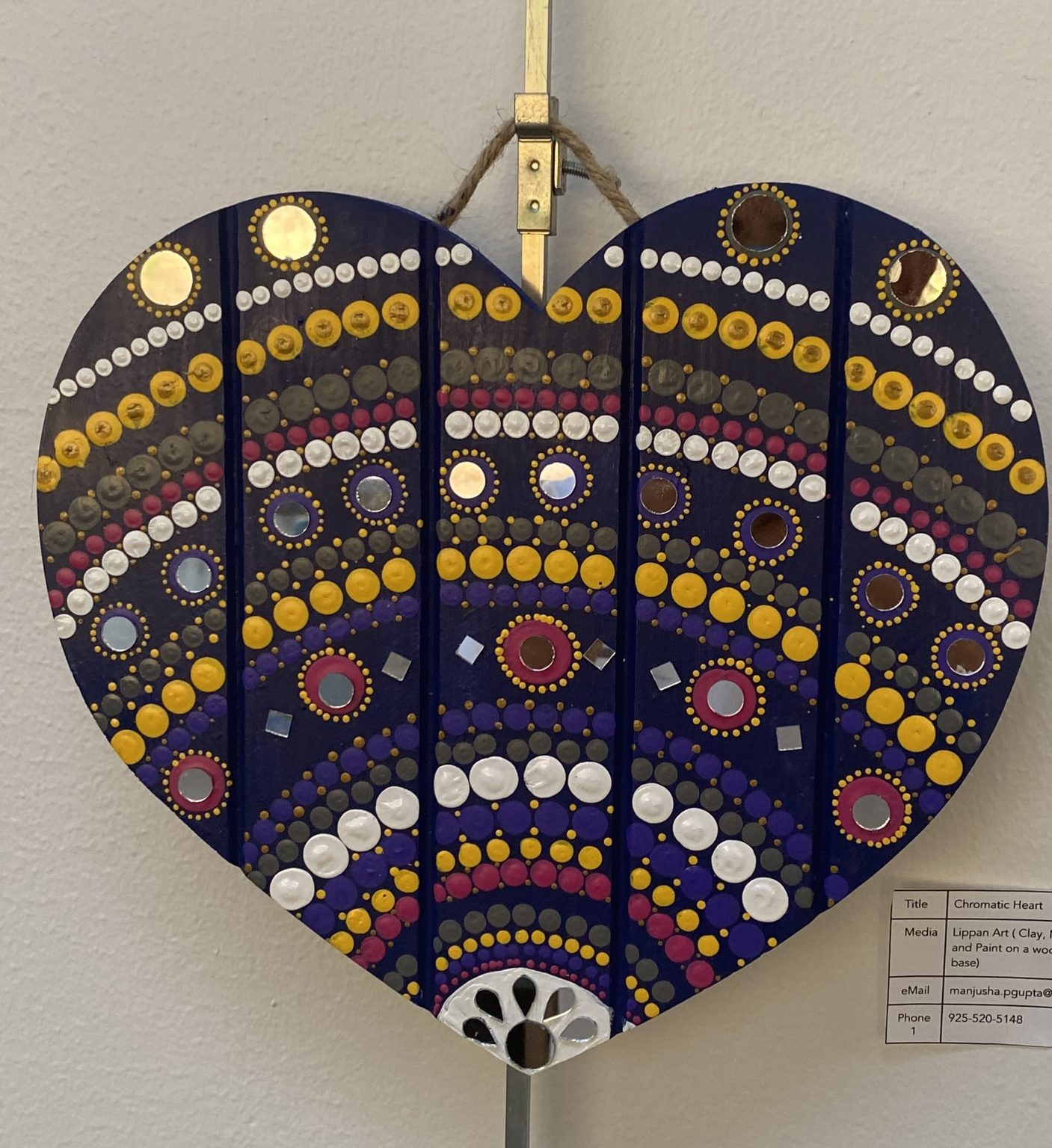 Gallery 2 - Heart shaped art work with colorful decoration on it made of dots and lines