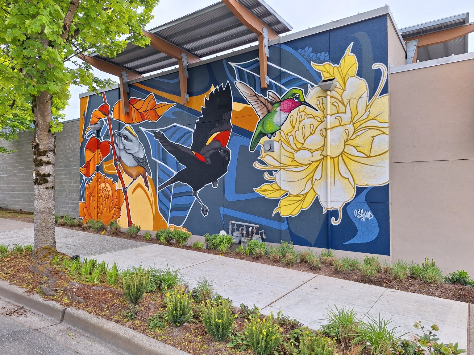 Gallery 3 - Exterior mural with redwing blackbird, hummingbird and flowers.