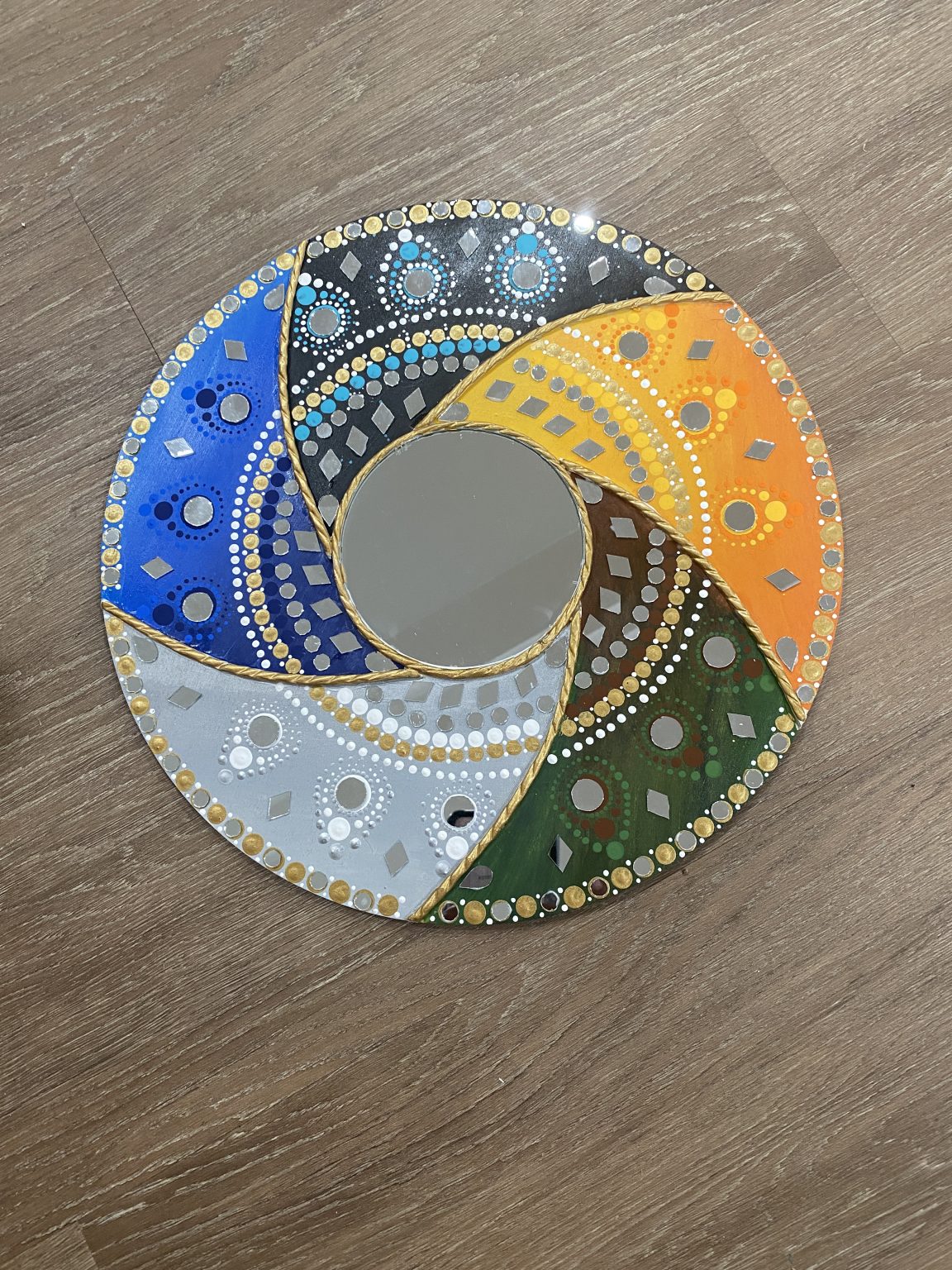 Gallery 3 - Round artwork with colored edge and circular mirror in the center