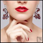 Gallery 4 - lower part of a woman's face with bright screen wearing handmade fabric jewelry.