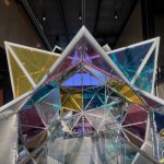 Gallery 4 - Interior view of 20' immersive stellated icosahedron form clad in colored acrylic panels.
