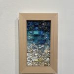 Gallery 5 - A plastic mosaic piece with the colors arranged from white at the bottom to dark blue and black 