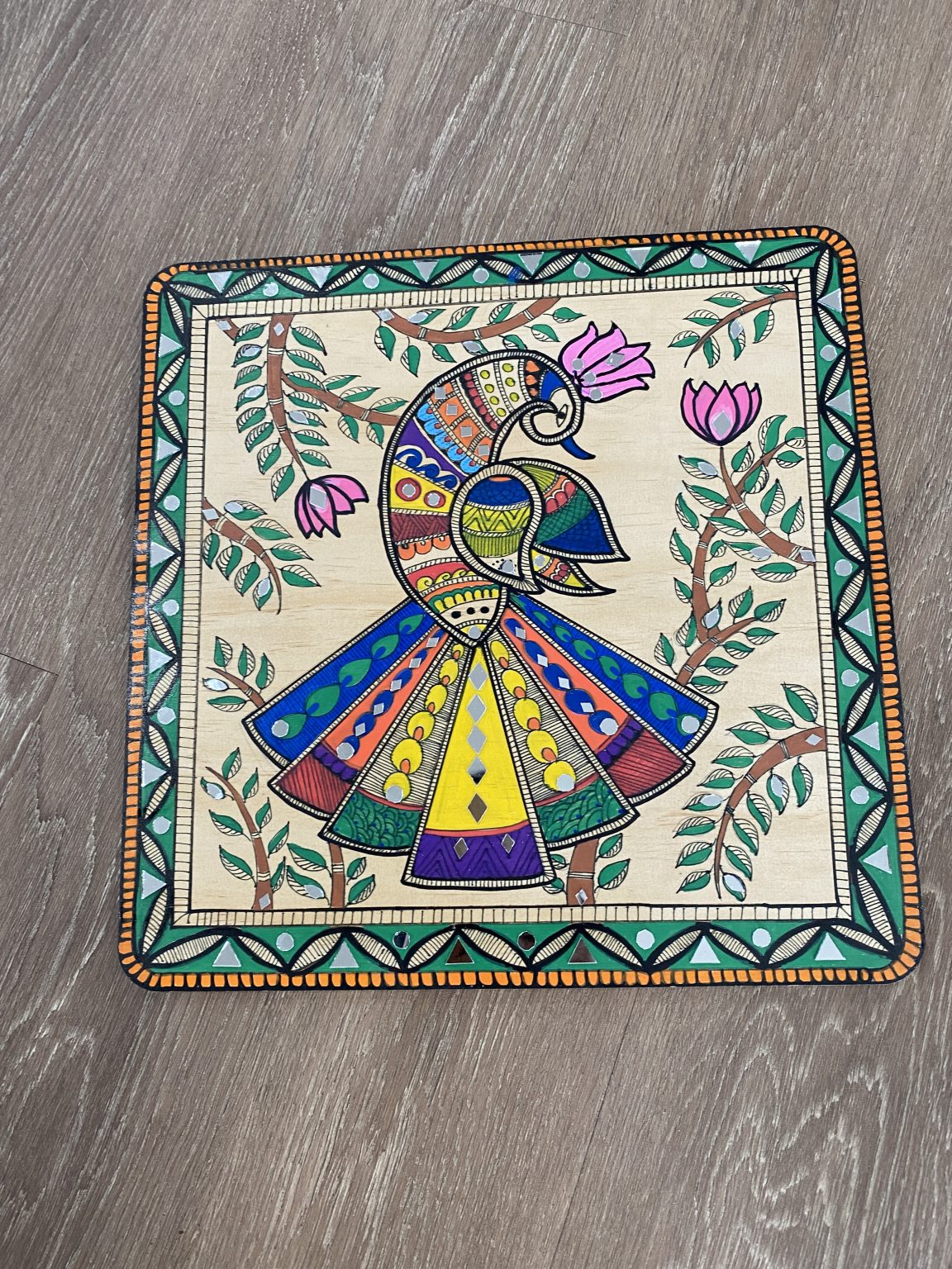 Gallery 5 - square artwork with rounded corners with a geometric bird in the center