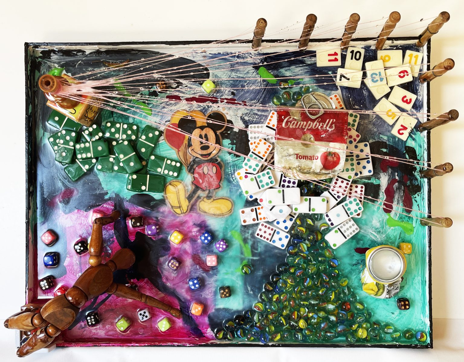 Gallery 5 - Mixed media assemblage that includes marbles, domino pieces, dice and wooden mickey mouse wooden cutout
