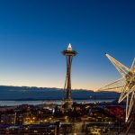 Gallery 6 - 20' 12-pointed illuminated star sculpture pictured against Seattle skyline at dusk.