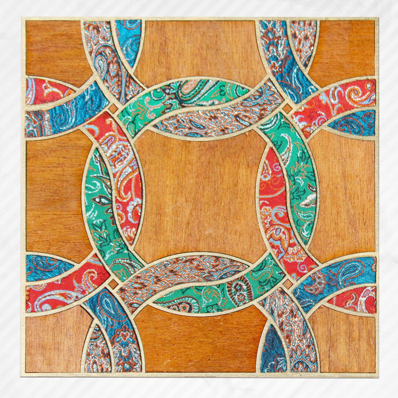 Gallery 7 - Handmade fabric wall-art consists of multiple colorful circles intertwined with one another.