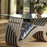 Gallery 10 - A glass coffee table with a silver base in the form of the Persian word 