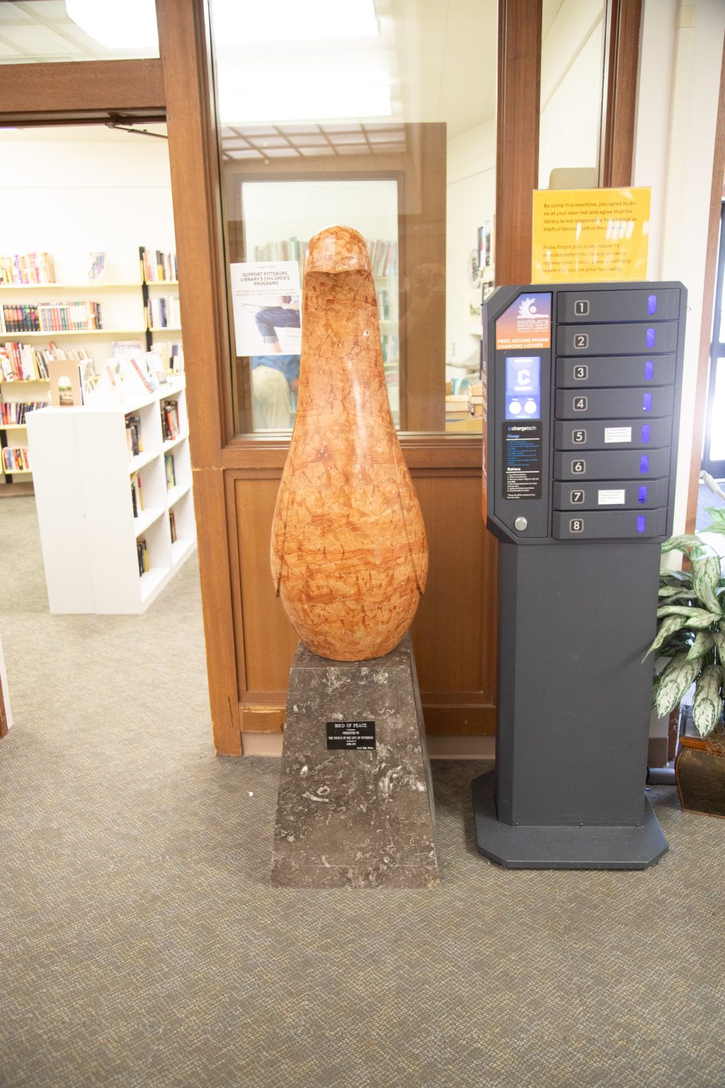 Gallery 2 - Stone sculpture of a Bird in the library environment