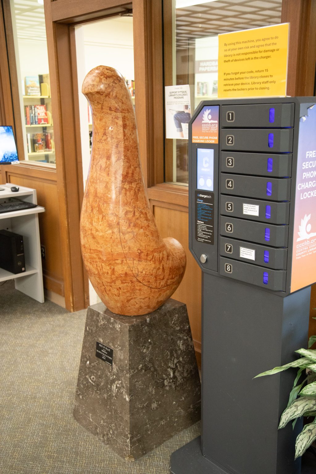 Gallery 1 - Stone sculpture of a Bird in the library environment