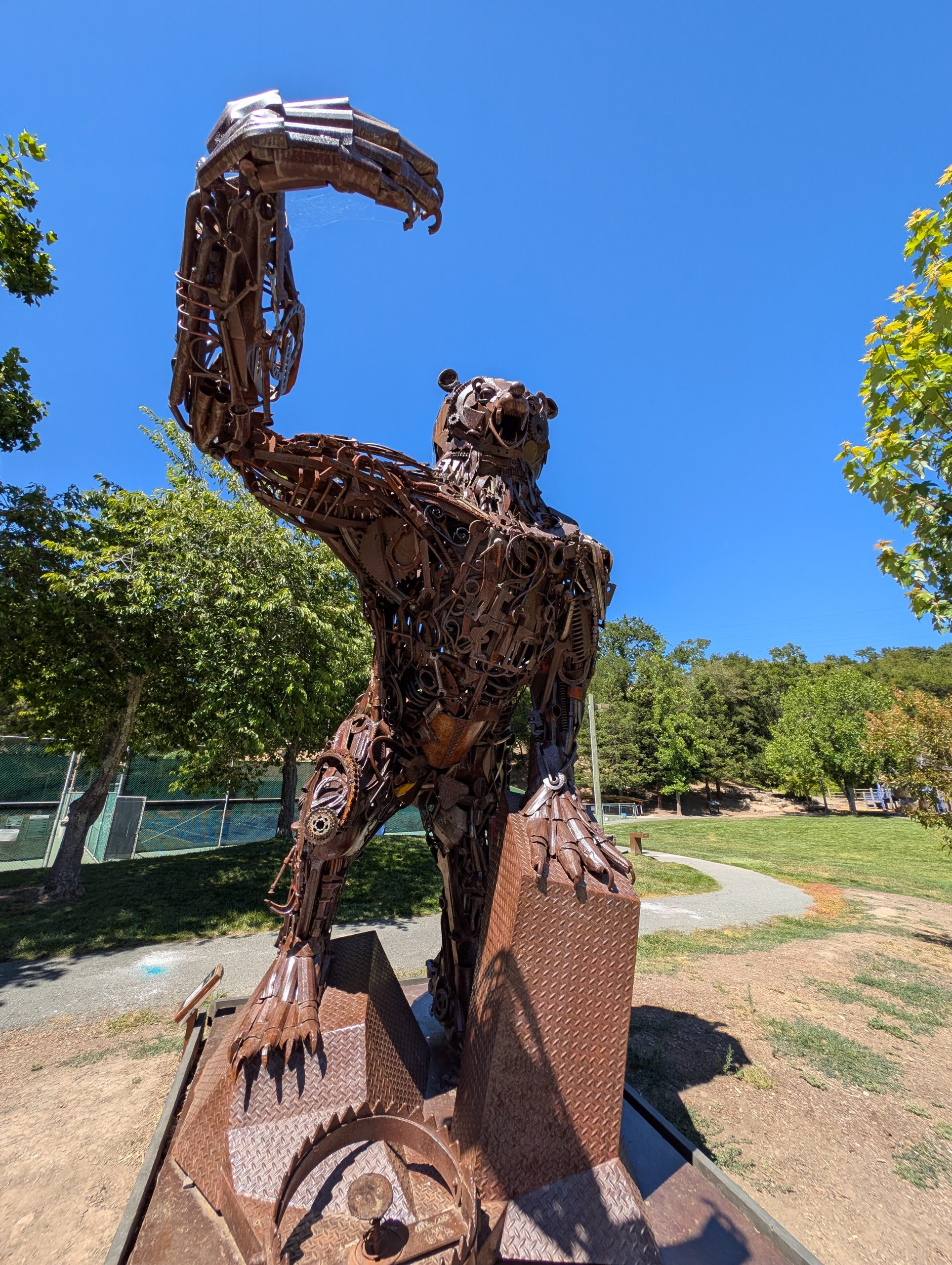 Gallery 7 - Image of a metal brown bear made of metal objects like gears and recycled equipment parts.