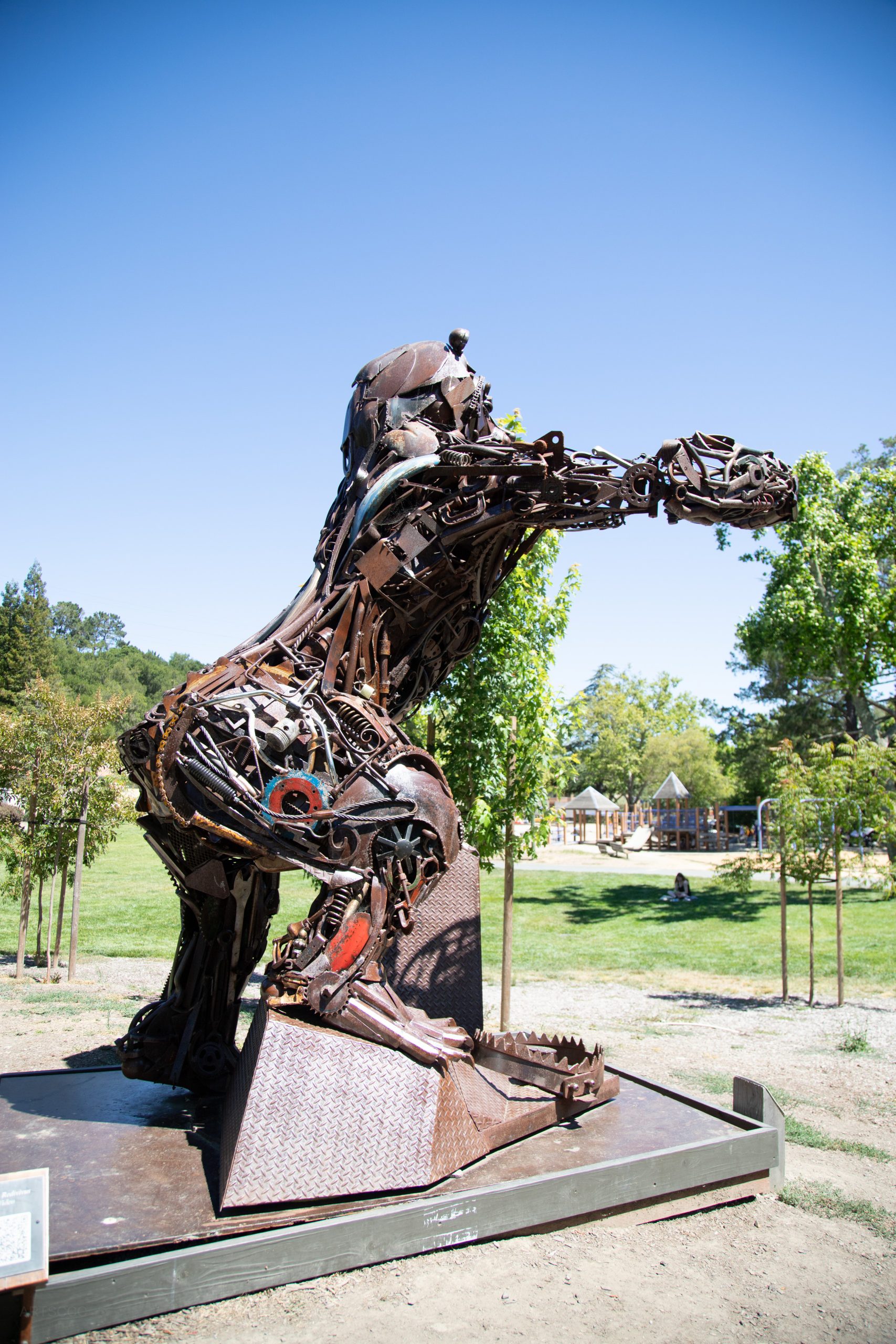 Gallery 5 - Image of a metal brown bear made of metal objects like gears and recycled equipment parts.