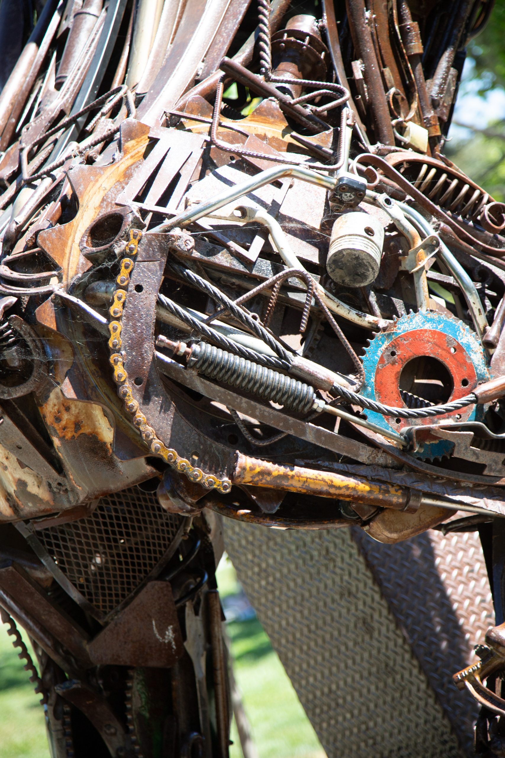 Gallery 4 - Image of a metal brown bear made of metal objects like gears and recycled equipment parts.