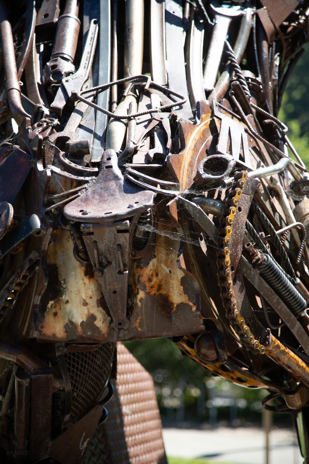 Gallery 3 - Image of a metal brown bear made of metal objects like gears and recycled equipment parts.
