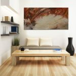 Gallery 1 - Abstract painting above a neutral-toned sofa with a wooden coffee table.