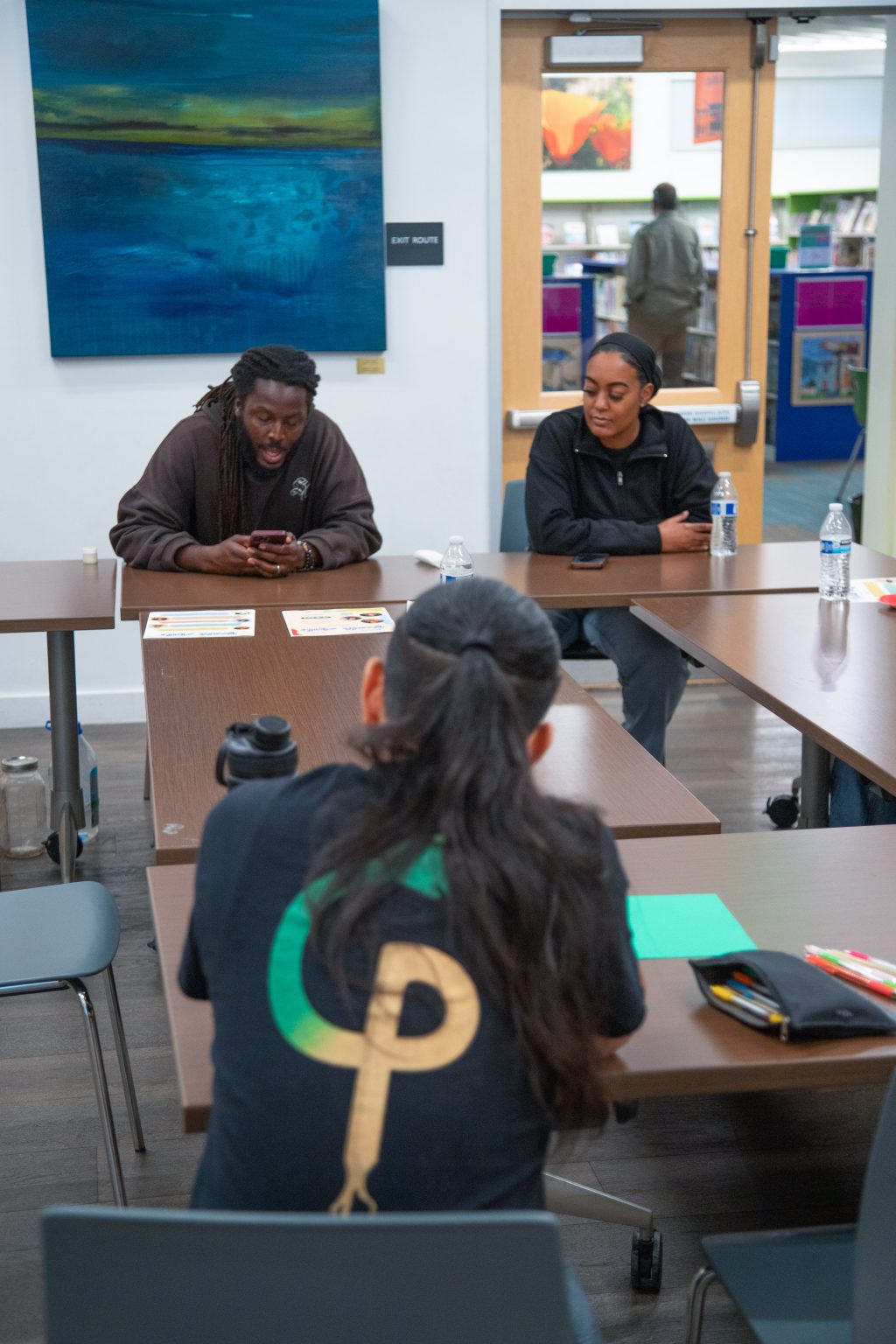 Gallery 1 - Donté Clark & Monique McCoy sitting at a table during a Youth Arts Connection workshop at the Brentwood Library.