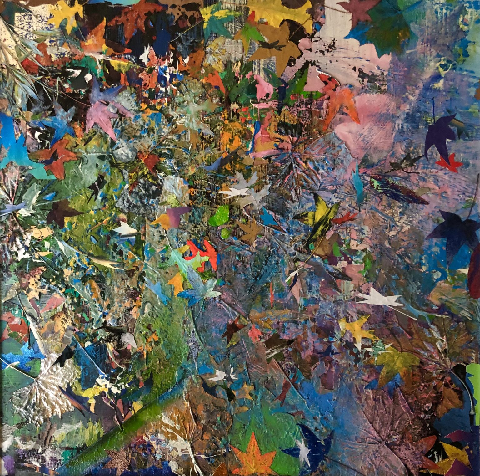 Gallery 1 - A close-up of a vibrant, heavily textured abstract painting or collage featuring a dense mix of colorful paint and cut-out shapes resembling autumn leaves. Mixed media on board, 32 x 30 x 2 inches