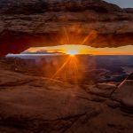 Gallery 2 - Picture of the sun rising through the window of Mesa Arch in Canyonlands National Park.