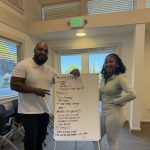 Gallery 1 - Tajanique Bell and Jeremy Phillip next to a white board at a “Youth Arts Connection” workshop at the Pittsburg Library.