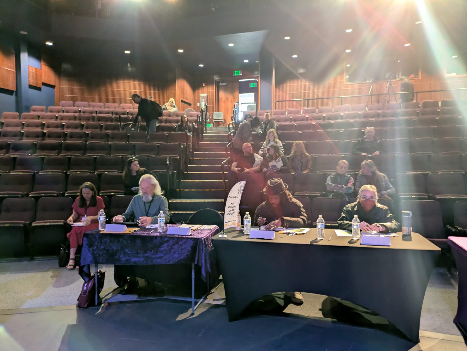 Gallery 4 - Donté Clark sitting with other judges at the 2025 Contra Costa County Poetry Out Loud Finals.