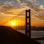 Gallery 6 - Picture of the Golden Gate Bridge with the sun rising over the San Francisco skyline.