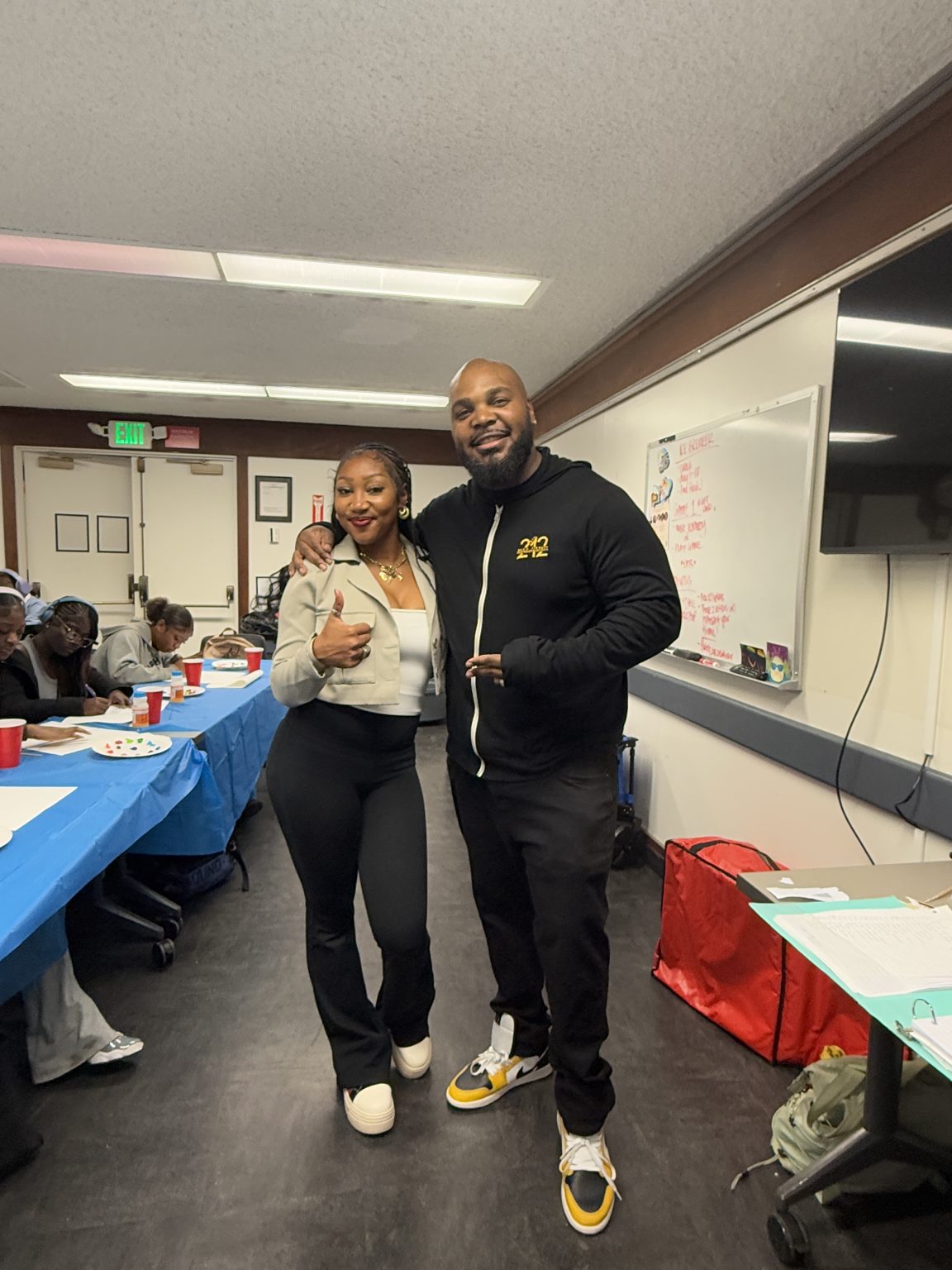 Gallery 4 - Tajanique Bell and Jeremy Phillip at a “Youth Arts Connection” workshop at the Antioch Library.