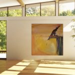 Gallery 5 - Square abstract painting featuring a dark figure perched on an edge, set against an orange-yellow background in a sunny room.