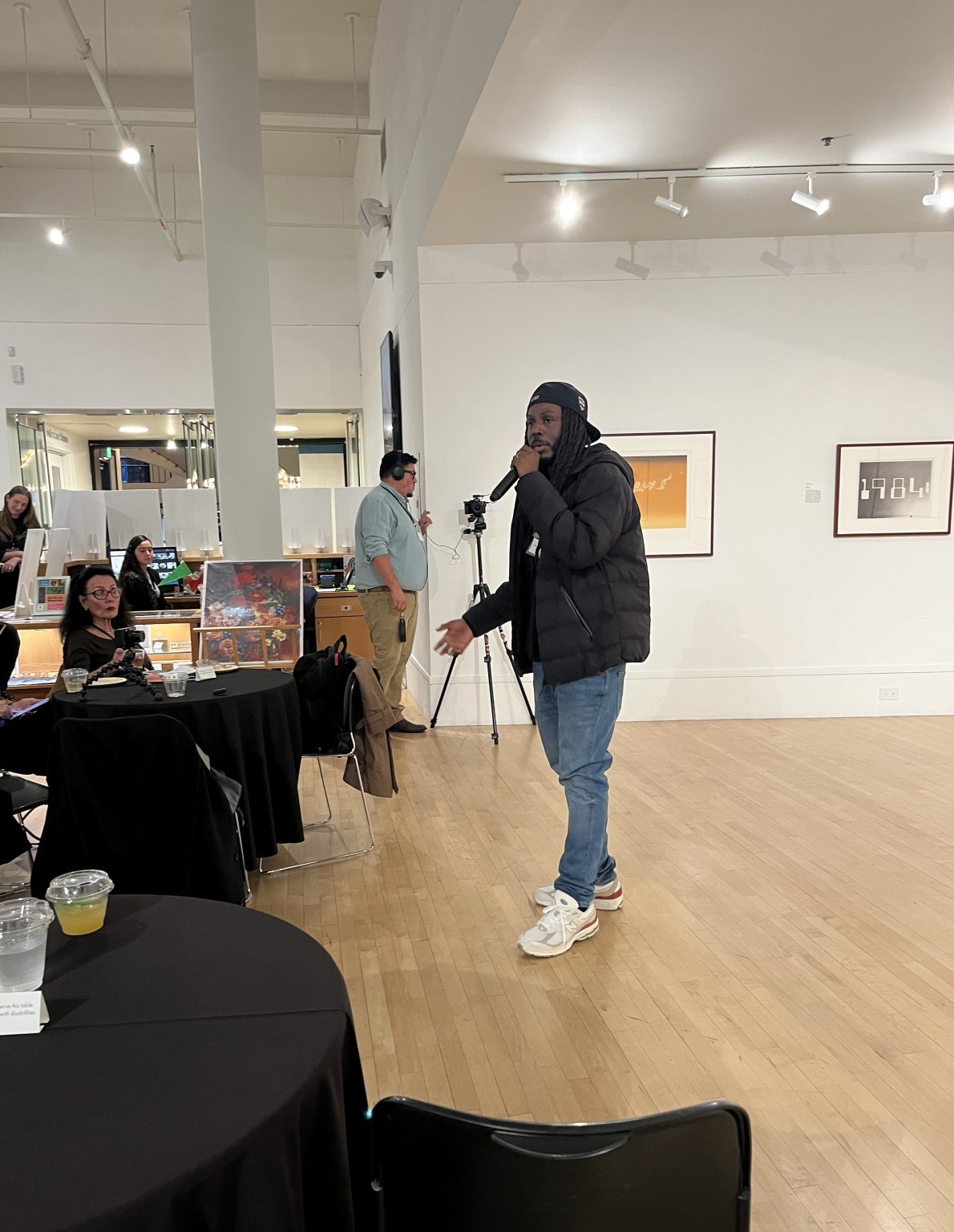 Gallery 5 - Donté Clark performing for a crowd at the ARTSCCC Happy Hour at the Bedford Gallery.