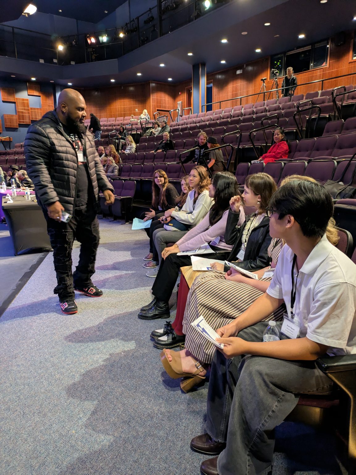 Gallery 5 - Jeremy Phillips before the 2025 Contra Costa Poetry Out Loud County Competition giving a pep talk to the High School champions.