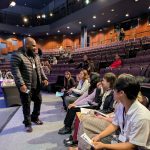 Gallery 5 - Jeremy Phillips before the 2025 Contra Costa Poetry Out Loud County Competition giving a pep talk to the High School champions.