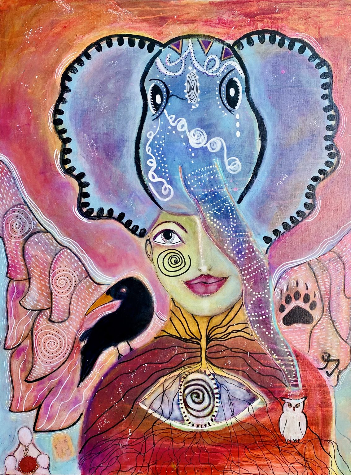 Gallery 5 - A vibrant mixed-media painting features a female figure with an elephant head as a headdress. The figure has a spiral-patterned eye and is adorned with a crow on her left shoulder and other symbolic animals, including an owl and a bear paw print, on an abstract orange and pink background.