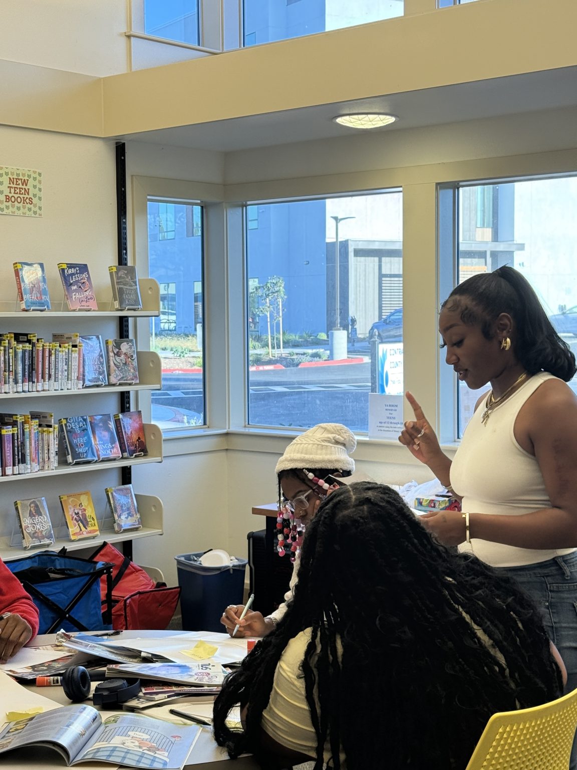 Gallery 5 - Tajanique Bell and students at a “Youth Arts Connection” workshop at the Pittsburg Library.
