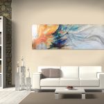 Gallery 7 - Long, horizontal abstract painting with orange, blue, and white colors above a white sofa.