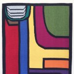 Gallery 2 - A brightly colored handwoven tapestry with abstract geometric shapes.