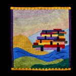 Gallery 4 - A handwoven tapestry with a geometric abstract raft on rolling waves and hills underneath a smokey s