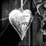 Gallery 2 - A high-contrast monochrome photograph by Stephanie Romanowski featuring a weathered metal heart with