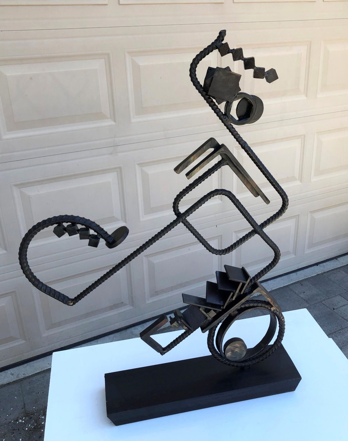 Gallery 5 - Forged and bent steel; rebar, threaded pipe, steel plate, angles, cubes, screw tip, steel discs, oil