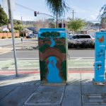 Gallery 1 - Two utility boxes featuring nature-themed murals. The larger box shows a 