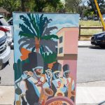 Gallery 4 - A series of three utility boxes painted with colorful murals. One box shows a classic black car with 