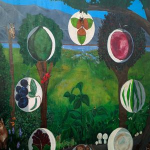 A vibrant outdoor mural on a neighborhood market featuring a large tree with detailed roots, a monarch butterfly, and scenes of community gardening. The artwork shows people harvesting produce and a landscape with solar panels and wind turbines in the background.