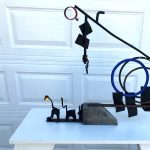 Gallery 7 - Forged and bent steel; plate, rod, bolts, radiator clamp, screws.  Rusted and painted. Stone base. 