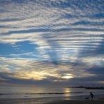 Gallery 1 - Photograph of a sunset sky with stippled clouds and blue sky