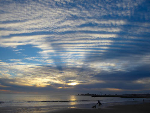 Gallery 1 - Photograph of a sunset sky with stippled clouds and blue sky
