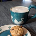Gallery 4 - Coffee mug (with coffee) and saucer (with muffin) featuring a dark teal background and cat carvings.