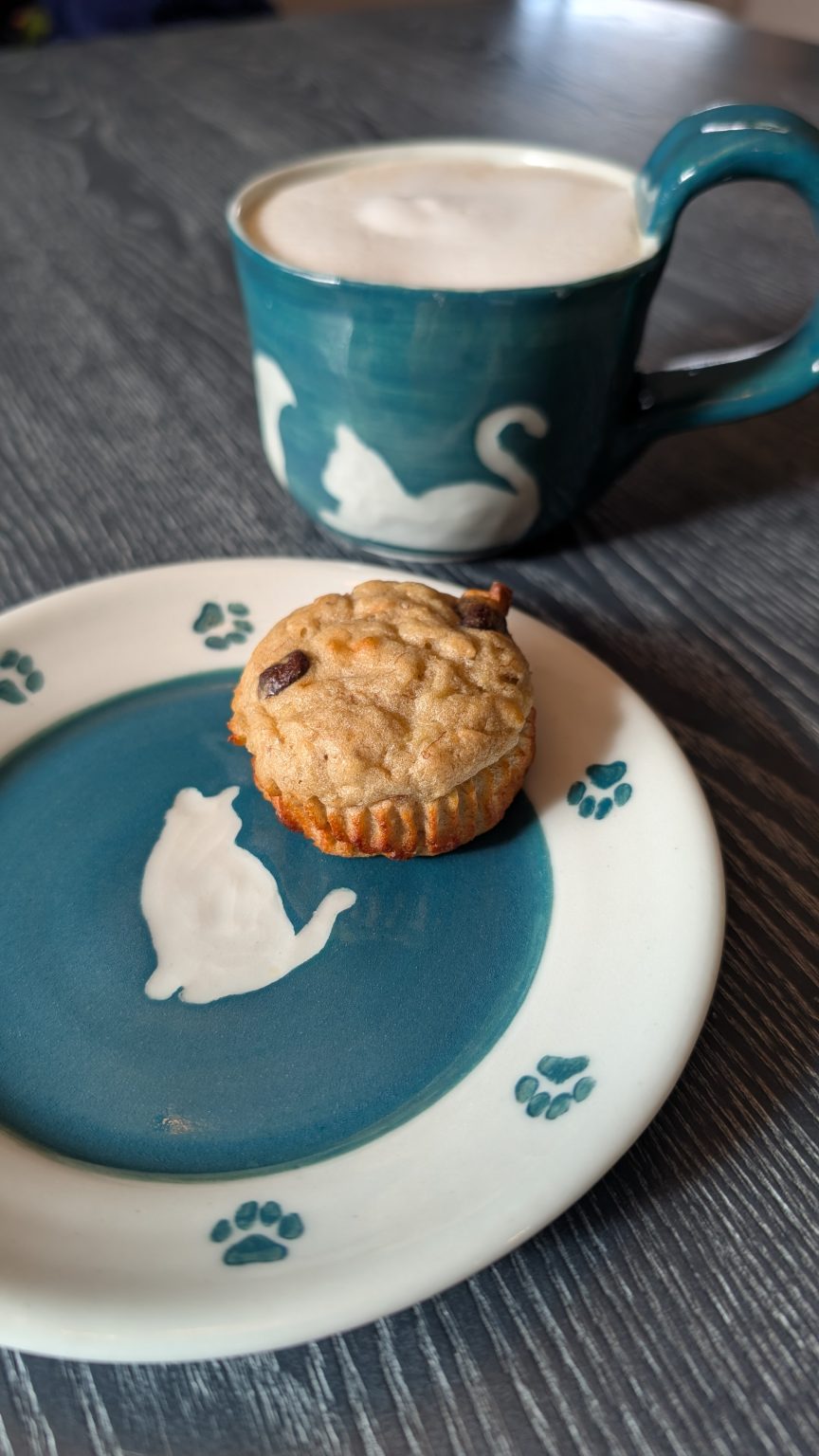 Gallery 4 - Coffee mug (with coffee) and saucer (with muffin) featuring a dark teal background and cat carvings.