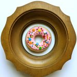 Gallery 5 - A 3D donut with sprinkles in a round vintage frame